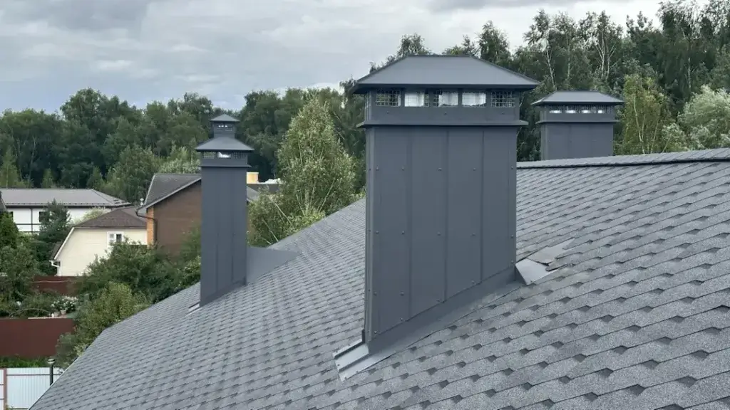 Вытяжные шахты на кровле частного дома